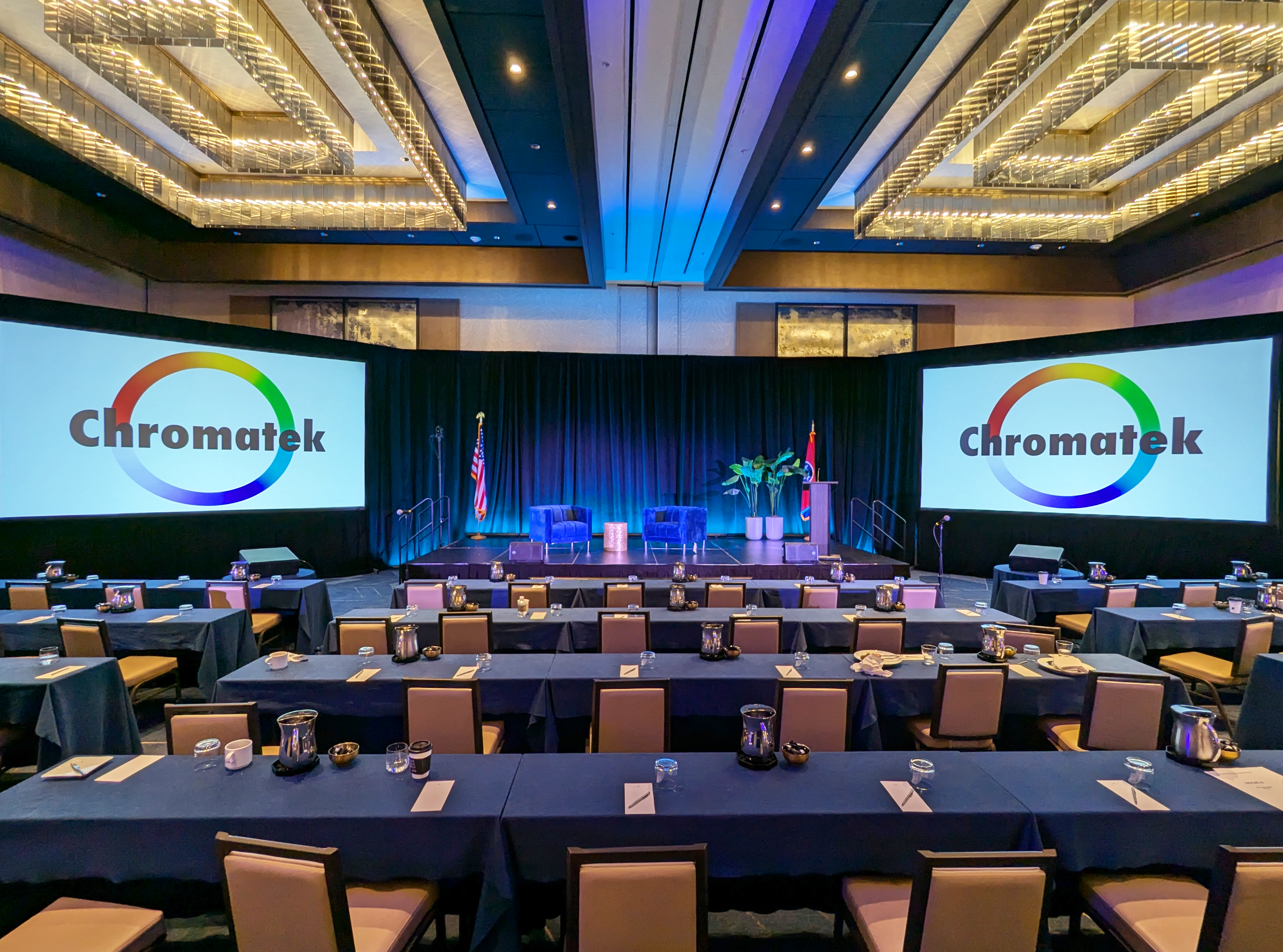 Live concert stage with dramatic LED lighting and professional AV setup